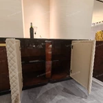 Curved Four-Door Sideboard with Quilted Upholstered Panels High-Gloss Burl Wood Veneer and Gold-Finish Metal Handles